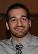 David Avellan, owner of Freestyle Fighting Academy, in a shirt and tie